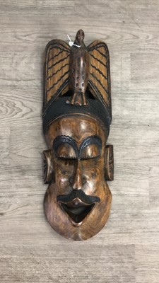 Lot 451 - AN AFRICAN CARVED MASK AND TWO STOOLS