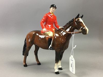 Lot 406 - A BESWICK FIGURE OF A HUNTSMAN ON HORSEBACK