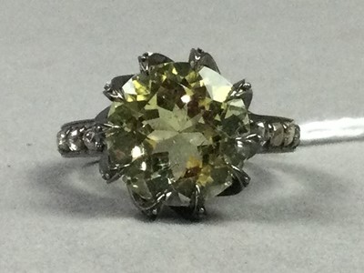 Lot 528 - A LEMON QUARTZ AND DIAMOND RING