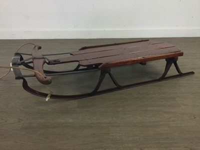 Lot 626 - A FLEXIBLE FLIER CAST IRON AND WOOD SLEDGE