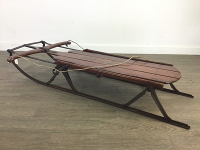 Lot 627 - A FLEXIBLE FLIER CAST IRON AND WOOD SLEDGE