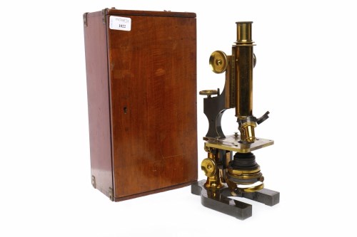 Lot 1022 - BRASS MICROSCOPE with brass mountings and...