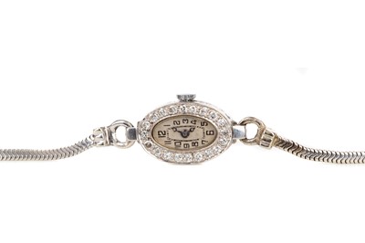 Lot 824 - A LADY'S EARLY 20TH CENTURY DIAMOND SET MANUAL WIND COCKTAIL WATCH