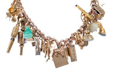 Lot 786 - AN IMPRESSIVE GOLD CHARM BRACELET