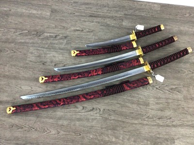 Lot 126 - A SET OF THREE REPRODUCTION JAPANESE SWORDS
