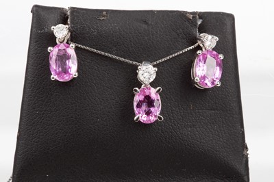 Lot 766 - A PINK SAPPHIRE PENDANT AND EARRING SET