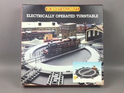 Lot 228 - A HORNBY RAILWAYS ELECTRICALLY OPERATED TURNTABLE AND CONTROLLERS