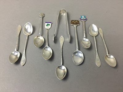 Lot 242 - A PAIR OF SILVER SUGAR TONGS AND NINE SILVER TEASPOONS