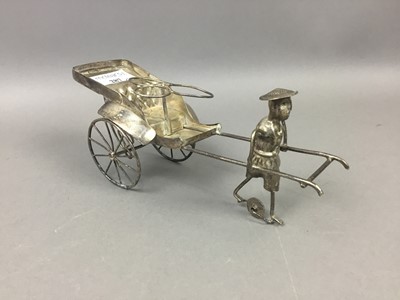 Lot 287 - A CHINESE WHITE METAL RICKSHAW CRUET STAND AND A PAIR OF BRASS EWERS