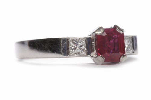 Lot 41 - RUBY AND DIAMOND THREE STONE RING the central...