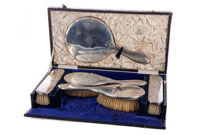 Lot 10 - A GEORGE V SILVER MOUNTED DRESSING TABLE SET