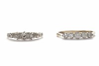 Lot 69 - TWO DRESS RINGS comprising a diamond three...