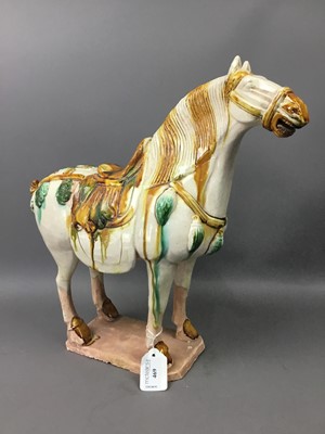Lot 469 - A CHINESE TANG-STYLE POTTERY HORSE