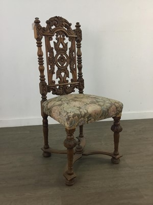 Lot 128 - A CARVED OAK CHAIR