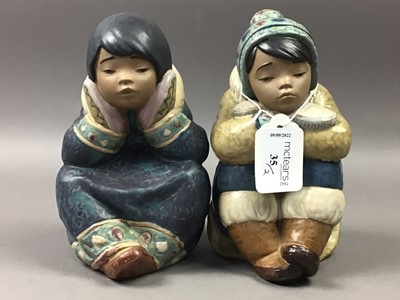 Lot 35 - A PAIR OF LLADRO FIGURES OF BOY AND GIRL PENSIVE ESKIMOS