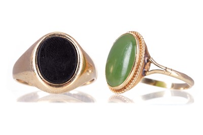 Lot 442 - A GREEN HARDSTONE PENDANT AND SIX RINGS