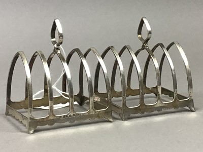 Lot 19 - A PAIR OF SILVER TOAST RACKS, CRUET SET, NAPKIN RING AND RATTLE