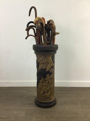 Lot 95 - A CERAMIC STICK STAND AND VARIOUS WALKING STICKS