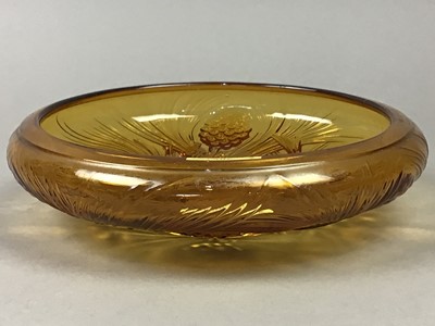 Lot 306 - AN ART DECO PRESSED AMBER GLASS BOWL, FIGURE OF A DANCER AND A HIP FLASK