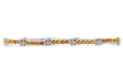Lot 476 - A YELLOW SAPPHIRE AND DIAMOND BRACELET