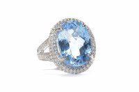 Lot 174 - BLUE TOPAZ AND DIAMOND RING set with a faceted...