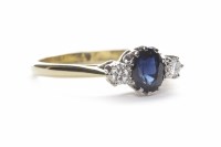 Lot 180 - SAPPHIRE AND DIAMOND THREE STONE RING the oval...