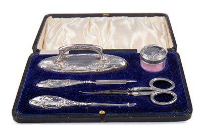 Lot 55 - A GEORGE V SILVER MOUNTED CUTICLE SET