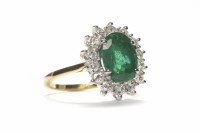 Lot 184 - EMERALD AND DIAMOND CLUSTER RING the central...