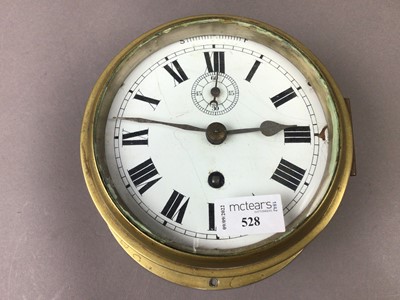 Lot 528 - A SHIP'S BRASS BULKHEAD CLOCK