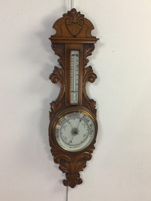 Lot 636 - A VICTORIAN OAK ANEROID WHEEL BAROMETER AND THERMOMETER