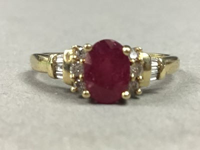 Lot 92 - A NINE CARAT GOLD RUBY AND DAMOND RING