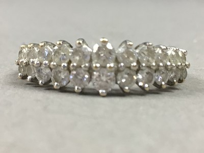 Lot 104 - A NINE CARAT GOLD DOUBLE ROW DIAMOND RING