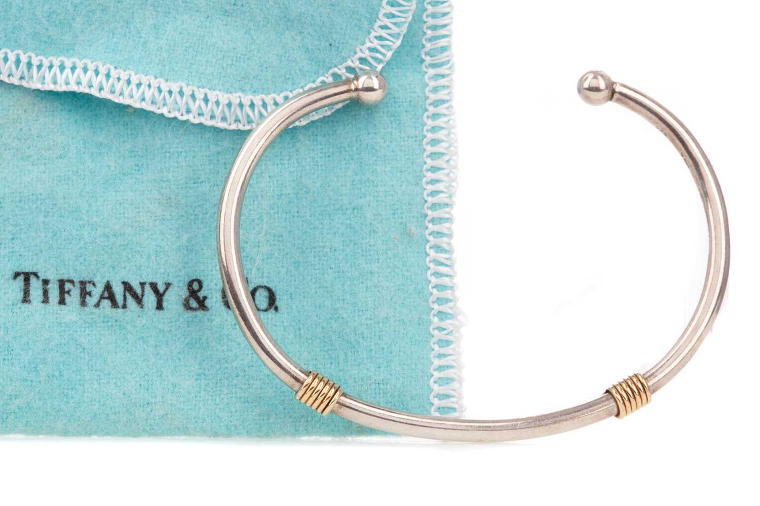 Lot 1202 - A SILVER AND GOLD TORQUE BANGLE BY TIFFANY & CO