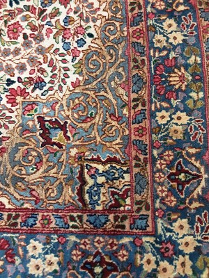 Lot 1306 - A PERSIAN KIRMAN RUG