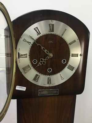 Lot 186 - A WALNUT GRANDMOTHER CLOCK