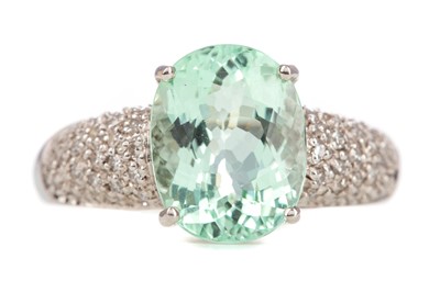 Lot 1210 - A PALE GREEN GEM SET AND DIAMOND RING