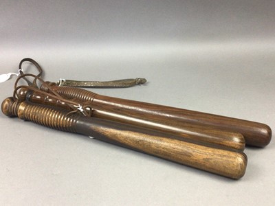 Lot 321 - THREE TURNED WOOD TRUNCHEONS