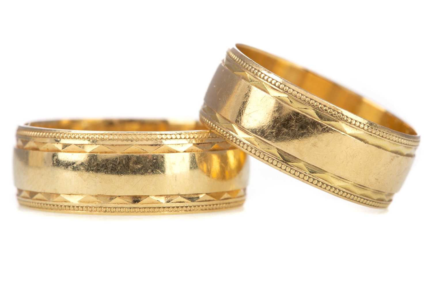 Lot 1232 - TWO EIGHTEEN CARAT GOLD 'HIS AND HERS' WEDDING BANDS