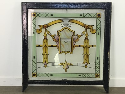 Lot 90 - A STAINED AND PAINTED GLASS PANEL IN WINDOW FRAME