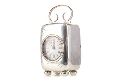 Lot 69 - AN EDWARDIAN SILVER MOUNTED SMALL SIZED MANTLE CLOCK