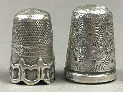 Lot 264 - A GROUP OF TWO SILVER AND A WHITE METAL THIMBLE