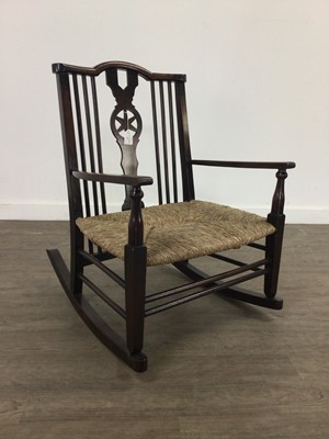 Lot 350 - A STAINED WHEEL BACK ROCKING CHAIR