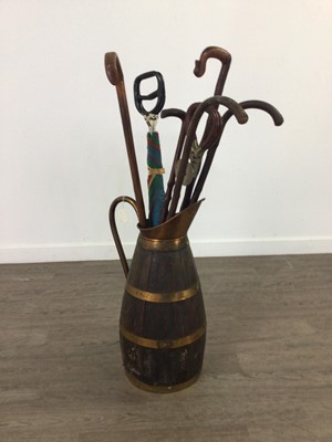 Lot 348 - A BRASS BOUND OAK STICK STAND AND VARIOUS STICKS