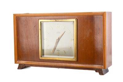 Lot 337 - A TEAK MID-CENTURY MANTEL CLOCK BY ELLIOT