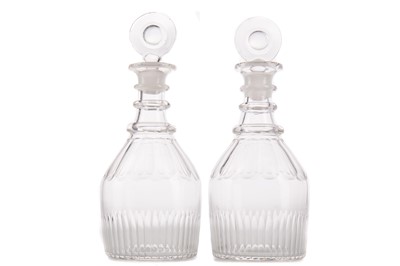 Lot 886 - A PAIR OF 19TH CENTURY CLEAR GLASS DECANTERS