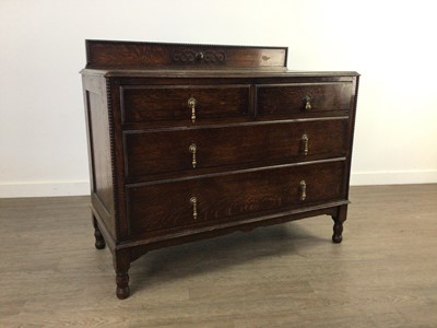 Lot 603 - AN OAK CHEST OF DRAWERS