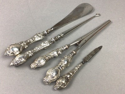 Lot 217 - A SILVER MOUNTED SHOE HORN, BUTTON HOOK, NAIL FILE AND GLOVE STRETCHERS