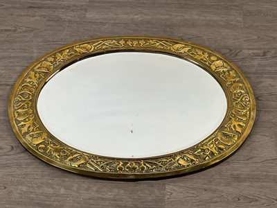 Lot 339 - AN ARTS & CRAFTS BRASS FRAMED OVAL WALL MIRROR