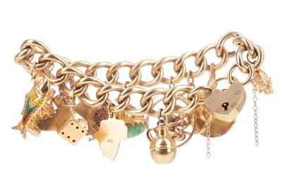 Lot 414 - A GOLD CHARM BRACELET