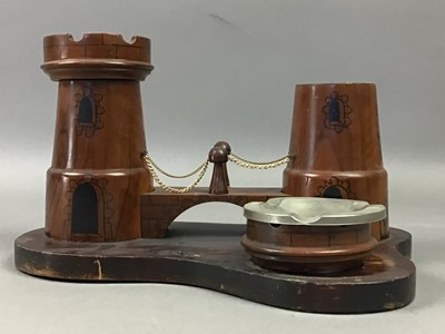 Lot 390 - A WOODEN CASTELLATED SMOKERS STAND